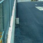 fresh asphalt is laid in the parking lot of a commercial facility